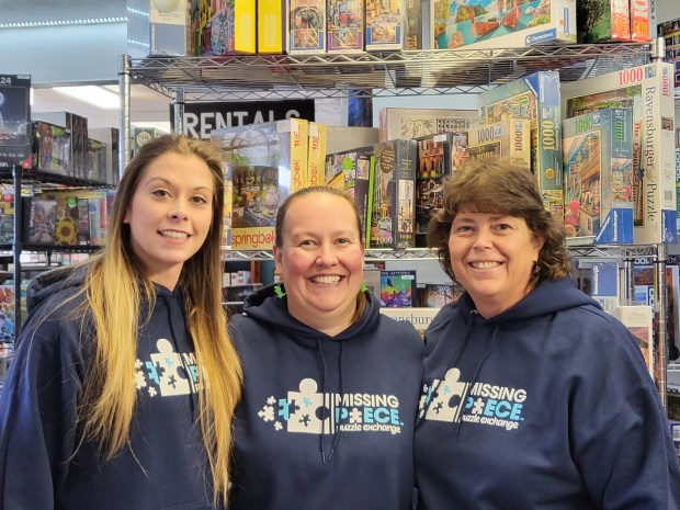 Erin Leidy (center) founded The Missing Piece Puzzle Exchange in 2020 and opened a retail store in 2023. (Provided by Erin Leidy)